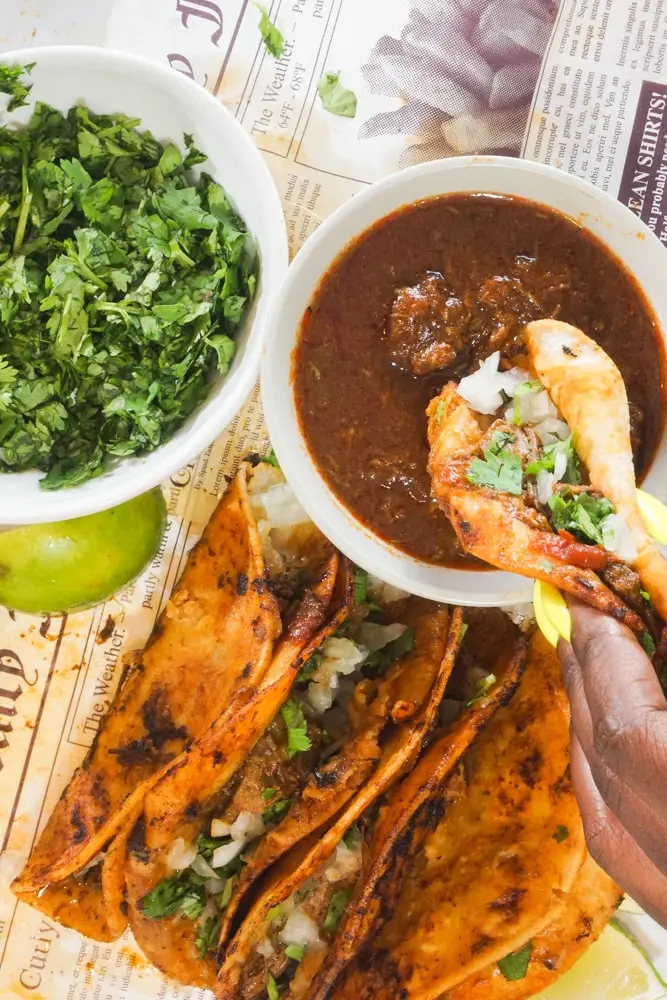 Gourmet birria tacos with shrimp and consommé