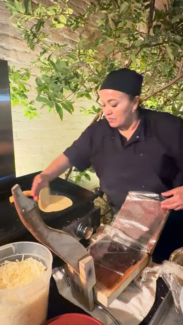 Gabby making handmade tortillas at a private catering event