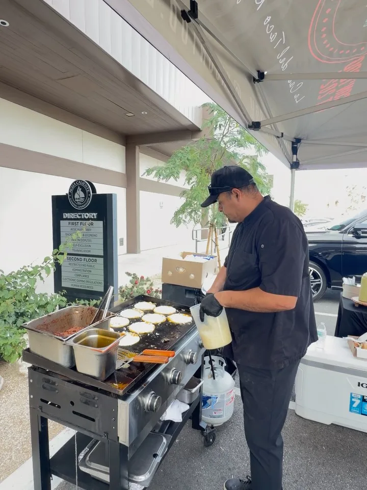 Omar grilling fresh tacos on-site at a Cathedral City catering event for TacoNTodo