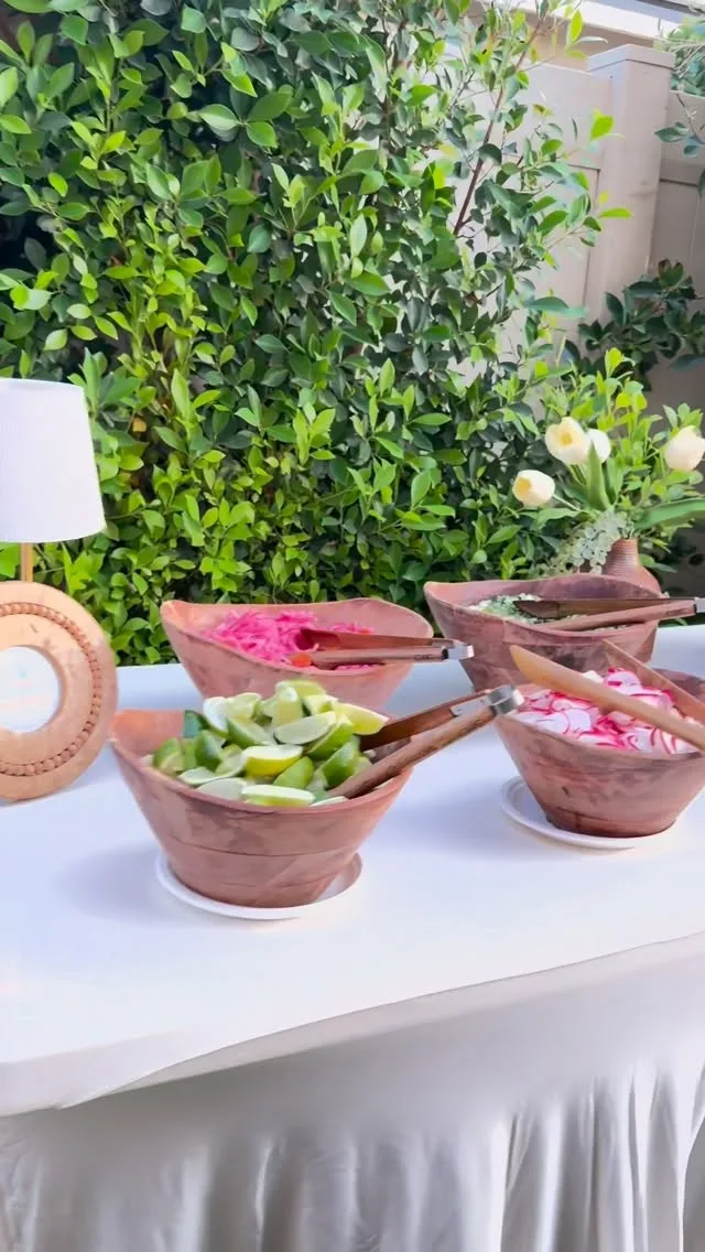 Elegant garnish bar in clay bowls at a rehearsal dinner