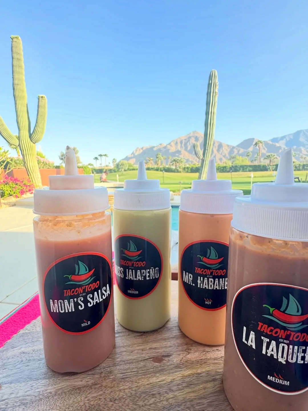 TacoNTodo signature salsas with desert mountain views at a Desert Hot Springs event