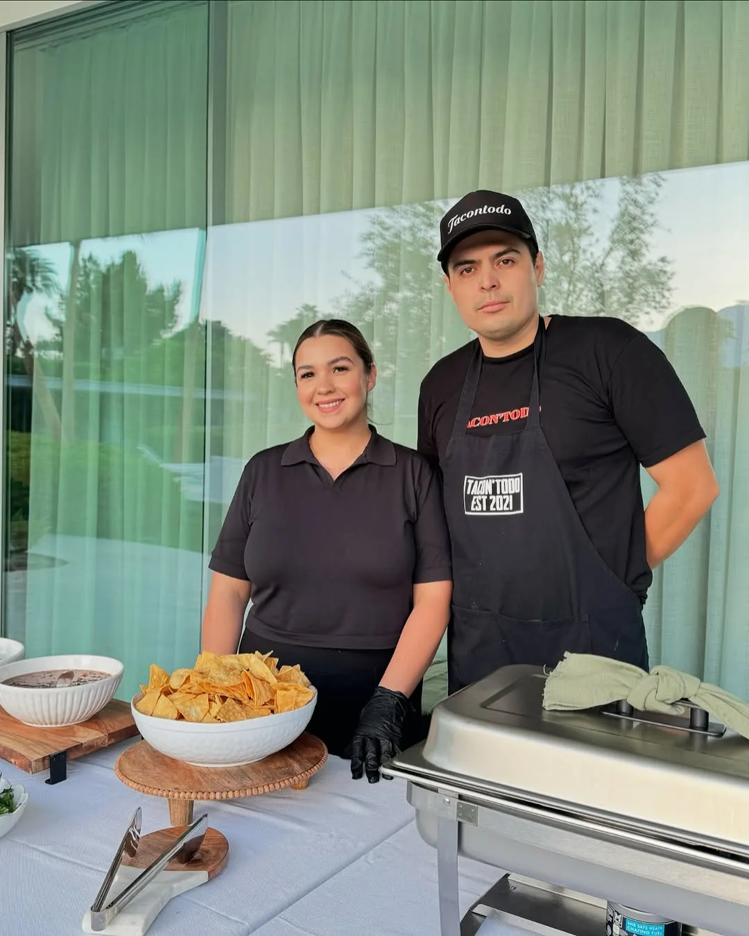 TacoNTodo team at a catering station ready to serve guests